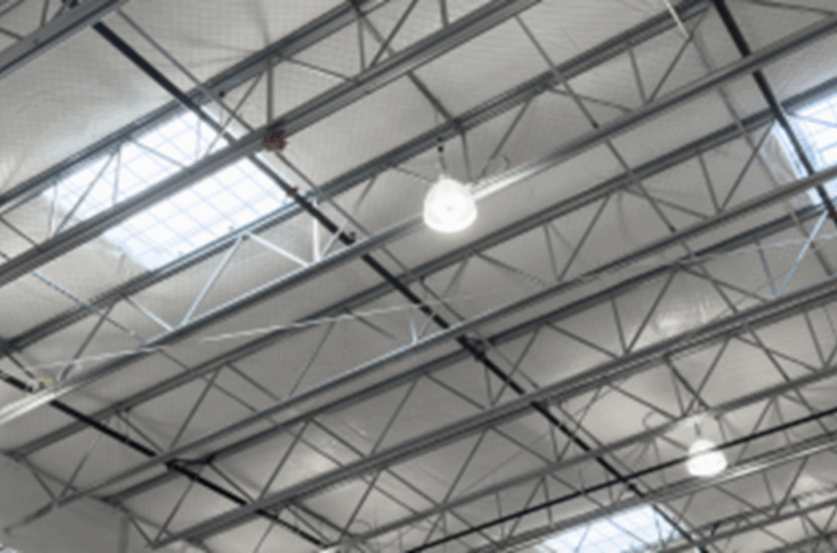 Interior ceiling of 212 Business Park industrial warehouse with exposed steel beams and skylights in Seattle commercial propert