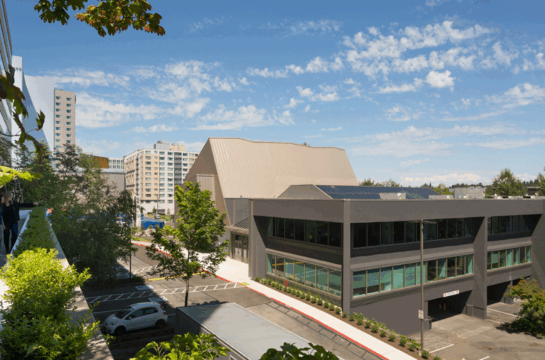 Exterior of Bellevue Congregational Church campus surrounded by urban residential and commercial development in downtown Bellevue WA