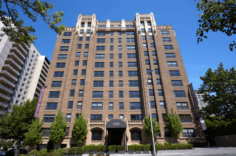 Historic Marlborough House apartment building in Seattle with ornate brick architecture and high-rise multifamily units