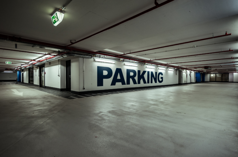 Clean and modern underground parking garage in stabilized asset managed by Trinity Real Estate for family office client