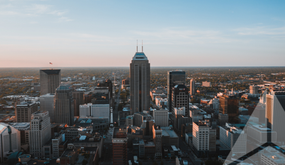 Downtown Skyline Image of Bellevue, WA with Trinity Real Estate Icon Overlay